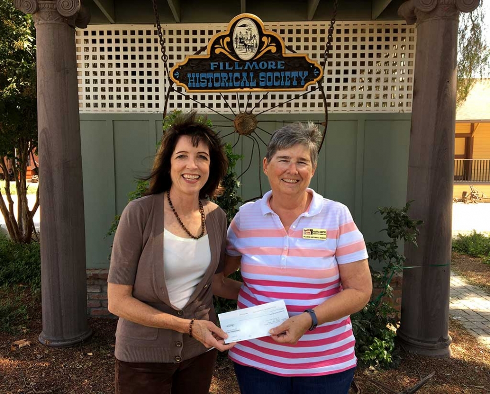 Leslie Klinchuch, Chevron Corporation (left), presents a check to Martha Gentry of the Fillmore Historical Museum. Photo courtesy Fillmore Gazette.